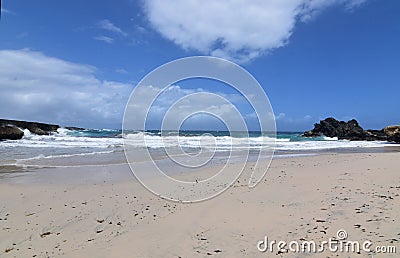 Rocks Lining the Sides of Andicuri Beach in Aruba Stock Photo