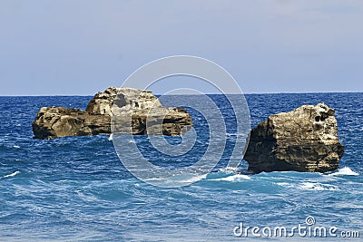 Rocks in the middel of ocean Stock Photo