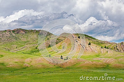 Rocks and rock cuts among the hills and steppes of Ded Khakassia in Kazanovka Stock Photo