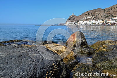 Rocks, sea and watchtower in Banos Castle Editorial Stock Photo