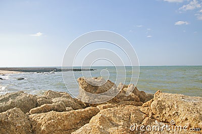 Rocks seaside. Rocks on the beach. Sunshine on the Stock Photo