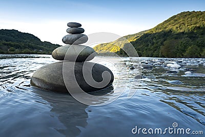 Rocks stack on the coast of Mountain River, concept of balance and harmony Stock Photo