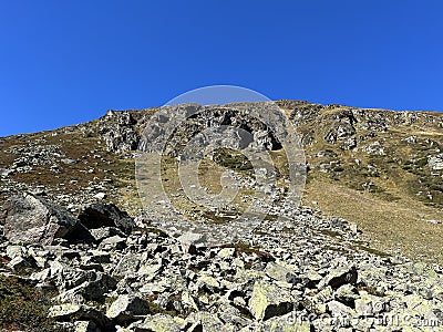 Rocks and stones in the autumn Alpine environment of the Albula Alps and above the Swiss mountain road pass Fluela Stock Photo