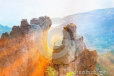Rocks and Stones of Mountain with rays of sun and aerial view seaside Stock Photo