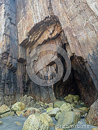 Rocks with straight edges on a beach Stock Photo