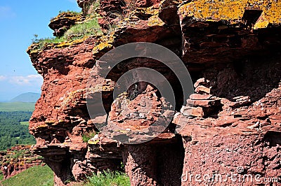 Rocks at the top of the hill of bizarre shape, worked over millennia by rain and wind Stock Photo
