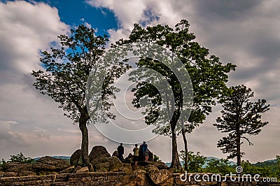 Rocks, trees, and tourists at an overlook on Skyline Drive in Sh Editorial Stock Photo