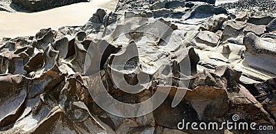Rocky beach against the sea in the afternoon Stock Photo