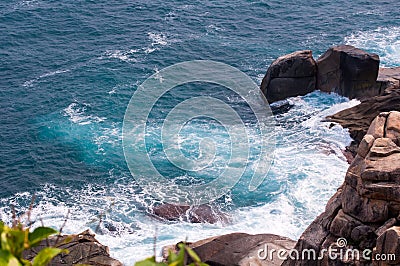 Rocky Beach and Beachcomber Stock Photo