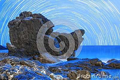 Rocky beach in the blue hour. Stock Photo