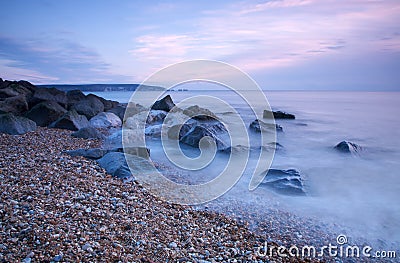 Rocky beach at dusk Stock Photo