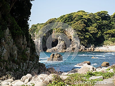 Rocky beach near Hakusan Domon natural arch on cape Ashizuri Stock Photo