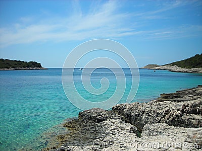 Rocky beach with turquoise waters, Hvar, Croatia Stock Photo