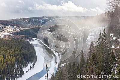 Rocky Butte `devil`s finger` within the rock `Osvenskii posts` and fog Stock Photo