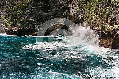 Rocky cliff, splashing waves and beautiful sea Stock Photo