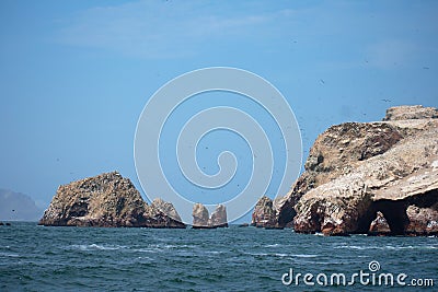 Rocky cliffs poking out of the coean Las Islas Ballestas Paracas Peru Stock Photo