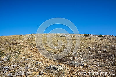 Rocky climb up the mountain and blue sky Stock Photo