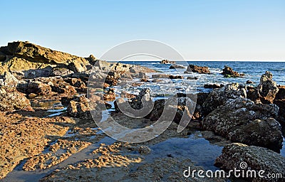 Rocky coastline at low tide below Heisler Park in Laguna Beach, California. Stock Photo