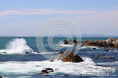 Rocky coastline with waves crashing Stock Photo