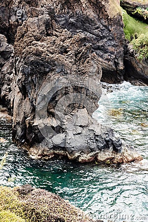 Rocky foot in the ocean Stock Photo