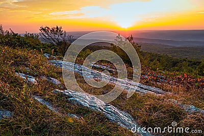 Rocky granite on top of the mountain at sunset Stock Photo