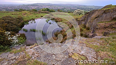 Rocky hilltop tarn and amazing view. Stock Photo