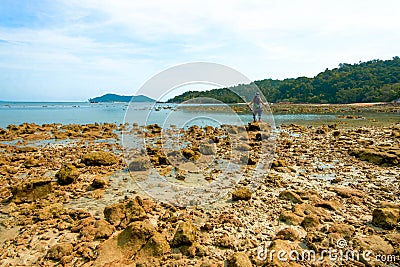 Rocky island coastal scenery during low tide at Besar Island or Pulau Besar in Mersing, Johor, Malaysia Editorial Stock Photo