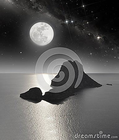 Rocky island in moonlight Stock Photo