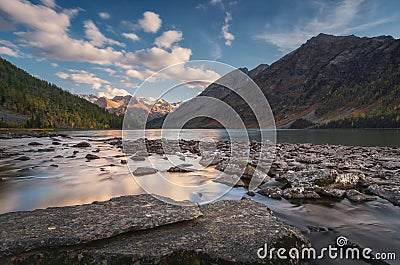 Rocky Lake Surrounded With Mountains Under Blue Sky, Altai Mountains Highland Nature Autumn Landscape Photo Stock Photo