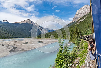 Rocky Mountaineer train traveling through the Rocky Mountains Editorial Stock Photo