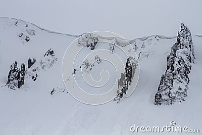 Rocky mountains and snow extreme cornices Stock Photo