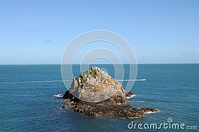 Rocky outcrop off the coast of Herm Stock Photo