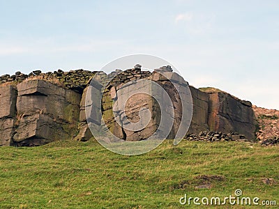 Rocky outcrops boulders and stone walls in yorkshire Stock Photo