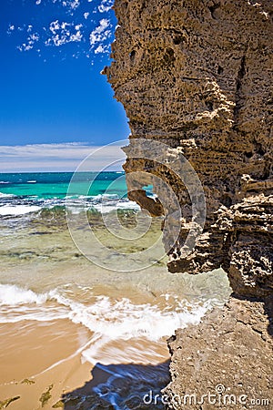 Rocky overhang on a tropical beach Stock Photo