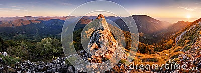 Rocky Panorama of sunset in mountain valley landscape Stock Photo