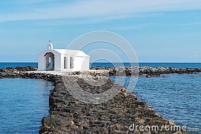 Rocky path which leads to small Agios Nikolaos church Stock Photo