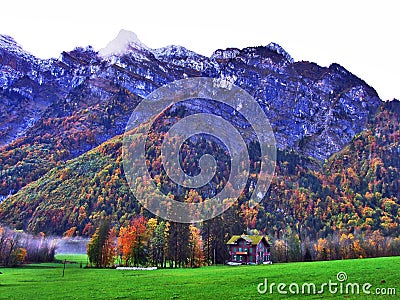 Rocky peak Stockli in the Glarus Alps mountain range and above Lake Klontalersee Stock Photo