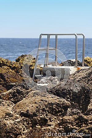 Rocky pool beach stairs in Biscoitos. Terceira island. Azores. P Stock Photo