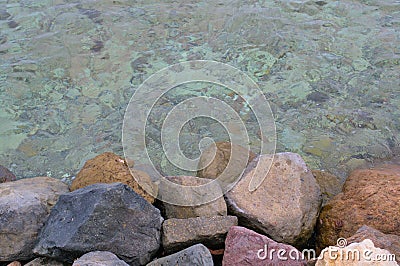 Rocky seashore with blue water. Colorful Red Sea Stock Photo