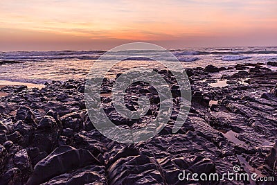 Rocky Shoreline Ocean Dawn Stock Photo