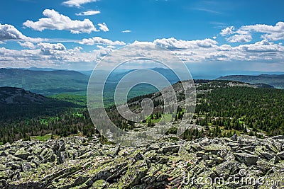 The rocky slope and mountain valleys on a cloudy day Stock Photo