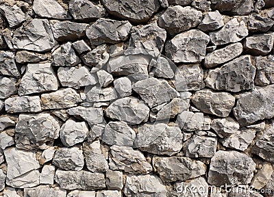 Rocky stone wall background texture - large natural rocks Stock Photo