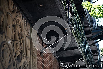 Rod iron fire escape on brick wall Stock Photo