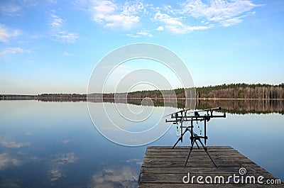 Rod pod with feeders with electronic bite alarms on pier Stock Photo