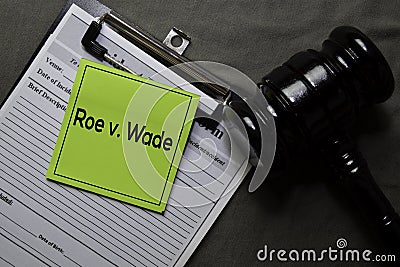 Roe v. Wade on sticky notes and gavel isolated on office desk. Law concept Stock Photo
