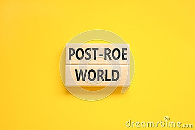 Roe vs Wade post-Roe world symbol. Concept words Post-Roe world on wooden blocks on a beautiful yellow table yellow background. Stock Photo