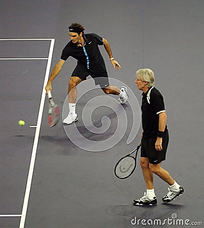 Roger Federer and Bjorn Borg in actions Editorial Stock Photo