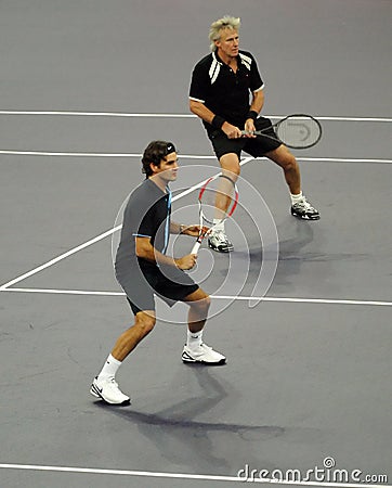 Roger Federerand Bjorn Borg in actions Editorial Stock Photo