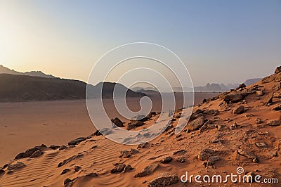 roks and red sand in wadi rum desert at sunset Stock Photo