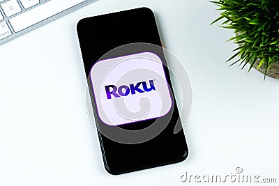 Roku app logo on a smartphone screen. Editorial Stock Photo